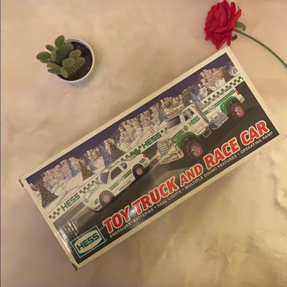 2011 HESS TRUCK WITH RACE CAR. Nib.